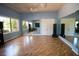 Spacious yoga studio with hardwood floors, mirrored walls, and natural light, ideal for fitness activities at 5473 Sunset Falls Dr, Apollo Beach, FL 33572