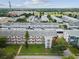 Aerial view showcases the condo complex's layout, landscaping, and parking facilities at 6015 19Th N St # 117, St Petersburg, FL 33714