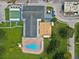 Aerial view of a community with a pool, various recreational facilities, and manicured green spaces at 6015 19Th N St # 117, St Petersburg, FL 33714