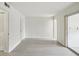 Bright, airy room with light-colored floors, neutral walls, and a sliding glass door to the outside at 6015 19Th N St # 117, St Petersburg, FL 33714
