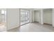 Bright bedroom featuring sliding glass doors, neutral paint, and an abundance of closet space at 6015 19Th N St # 117, St Petersburg, FL 33714