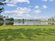 Scenic view of a pond surrounded by lush greenery and well-maintained landscaping at 6015 19Th N St # 117, St Petersburg, FL 33714