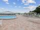 Community pool area with lounge chairs and a covered seating area for residents at 6015 19Th N St # 117, St Petersburg, FL 33714