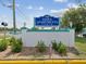 Welcoming entrance sign for 1900 Town Apartments North 55+ Condominiums at 6015 19Th N St # 117, St Petersburg, FL 33714
