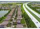 Aerial view displays community near a highway, with water features, landscaping, and neighborhood streets at 6218 Magnolia Park Blvd, Riverview, FL 33578