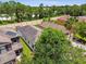 An aerial view showcasing the property's roof, surroundings and privacy fence at 6218 Magnolia Park Blvd, Riverview, FL 33578