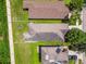 Aerial view showcasing the house's roof and backyard with a well-maintained lawn and fence, surrounded by neighboring homes at 6218 Magnolia Park Blvd, Riverview, FL 33578