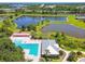 Gorgeous aerial view of a community pool, clubhouse and several serene lakes at 6218 Magnolia Park Blvd, Riverview, FL 33578