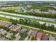 Aerial view of the community near a major highway, with easy access to amenities and transportation routes at 6218 Magnolia Park Blvd, Riverview, FL 33578