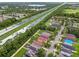 Overhead shot of the neighborhood near a highway and lake, providing a glimpse of the community's location and amenities at 6218 Magnolia Park Blvd, Riverview, FL 33578