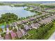 Scenic aerial view of the home's neighborhood with a beautiful lake view, lush greenery, and well-maintained landscapes at 6218 Magnolia Park Blvd, Riverview, FL 33578