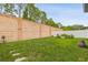 Large backyard features lush lawn space surrounded by privacy fencing, ready for outdoor enjoyment and entertainment at 6218 Magnolia Park Blvd, Riverview, FL 33578
