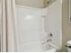Clean bathroom featuring a tiled shower, bathtub with a shower curtain, and neutral wall colors at 6218 Magnolia Park Blvd, Riverview, FL 33578