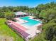 Community pool featuring a pergola and numerous lounge chairs for residents at 6218 Magnolia Park Blvd, Riverview, FL 33578