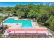 Community pool featuring fountains and shaded lounge areas and lush landscaping at 6218 Magnolia Park Blvd, Riverview, FL 33578