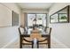 Elegant dining room with a modern glass table and sliding glass doors to the patio at 6218 Magnolia Park Blvd, Riverview, FL 33578