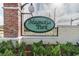 Magnolia Park entrance sign with brick columns and manicured shrubbery at 6218 Magnolia Park Blvd, Riverview, FL 33578