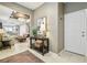 Inviting foyer with stylish console table and open view to the living spaces at 6218 Magnolia Park Blvd, Riverview, FL 33578