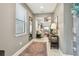 Inviting foyer with stylish console table and open view to the living spaces at 6218 Magnolia Park Blvd, Riverview, FL 33578