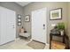 Welcoming foyer with a bench, decorative art, and convenient access to other rooms at 6218 Magnolia Park Blvd, Riverview, FL 33578