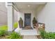 Cozy front porch featuring a bench and potted plants for a welcoming entrance at 6218 Magnolia Park Blvd, Riverview, FL 33578