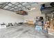 Spacious garage with overhead storage racks and ample room for vehicles and storage containers at 6218 Magnolia Park Blvd, Riverview, FL 33578