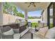 Inviting covered patio with a built-in grill, outdoor seating, and ceiling fan for comfortable outdoor living at 6218 Magnolia Park Blvd, Riverview, FL 33578