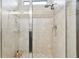 Walk-in shower with glass door and tile surround at 6218 Magnolia Park Blvd, Riverview, FL 33578