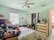 Bedroom with a bed, closet, and dresser, with lots of clutter at 6832 Treehaven Dr, Spring Hill, FL 34606