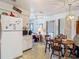 Functional kitchen with classic white cabinetry and a cozy adjacent dining area at 6832 Treehaven Dr, Spring Hill, FL 34606