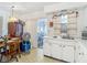 Functional kitchen offering stainless steel sink, white cabinetry, and an eat-in dining area at 6832 Treehaven Dr, Spring Hill, FL 34606