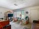 Cozy living room with a large window providing natural light and neutral carpeting at 6832 Treehaven Dr, Spring Hill, FL 34606