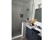 Modern bathroom with sleek shower, vanity and elegant fixtures at 9397 Northcliffe Blvd, Spring Hill, FL 34606