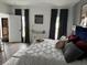 Comfortable bedroom featuring a plush bed with stylish decor and natural light at 9397 Northcliffe Blvd, Spring Hill, FL 34606