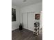 Bright and spacious room with hard wood floors, a white closet, and a small side table at 9397 Northcliffe Blvd, Spring Hill, FL 34606