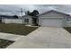 Beautiful home featuring a well-maintained lawn and a spacious driveway at 9397 Northcliffe Blvd, Spring Hill, FL 34606
