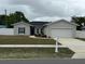 Charming single-story home with a well-manicured lawn and a two-car garage at 9397 Northcliffe Blvd, Spring Hill, FL 34606