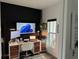 Modern office space with dual monitors, sleek desk, and ample natural light at 9397 Northcliffe Blvd, Spring Hill, FL 34606