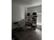 Brightly lit interior room with dark floors and shelves at 9397 Northcliffe Blvd, Spring Hill, FL 34606