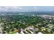 Expansive aerial view showcasing the property's location within a lush, green neighborhood with proximity to the water at 101 N Corona Ave, Clearwater, FL 33765