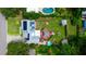 Detailed aerial shot highlights a backyard with a pool, large deck with gazebo, and lush landscaping at 101 N Corona Ave, Clearwater, FL 33765