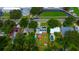 Aerial shot of a backyard featuring a pool, gazebo, colorful seating, and lush landscaping for outdoor enjoyment at 101 N Corona Ave, Clearwater, FL 33765