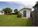 Backyard with a small cabana shed featuring charming details, offering a private retreat at 101 N Corona Ave, Clearwater, FL 33765