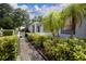 A close-up of the front exterior highlighting the home's design elements, landscaping, and inviting walkway at 101 N Corona Ave, Clearwater, FL 33765