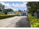 Charming single-story home with well-maintained landscaping, featuring a long driveway and attached garage at 101 N Corona Ave, Clearwater, FL 33765