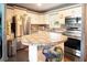 Bright kitchen featuring tile countertops, stainless steel appliances, and modern fixtures at 101 N Corona Ave, Clearwater, FL 33765
