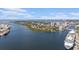 Aerial view of waterfront condos with stunning water views, coastal highway access, and nearby shipping channels at 1107 Normandy Trace Rd, Tampa, FL 33602