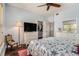 Relaxing bedroom featuring a ceiling fan, hardwood floors, natural light, and ample closet space at 1107 Normandy Trace Rd, Tampa, FL 33602