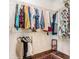Walk-in closet with ample storage space, including wire shelving and hardwood floors, ideal for organizing clothing at 1107 Normandy Trace Rd, Tampa, FL 33602