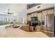 Bright kitchen features light wood cabinets, stainless steel appliances, and a breakfast bar overlooking the outdoors at 1107 Normandy Trace Rd, Tampa, FL 33602